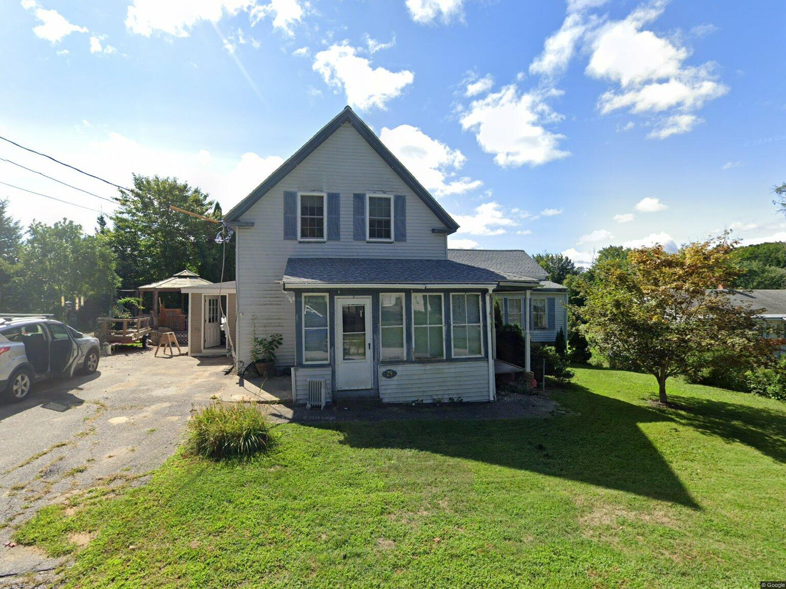 25 Mill Street before its renovation, the original 1925 farmhouse with weathered siding